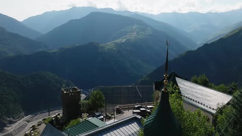 Goldenspire Mosque Amid Lush Mountains in a Remote Village Mountain Mosque with Golden Spire and