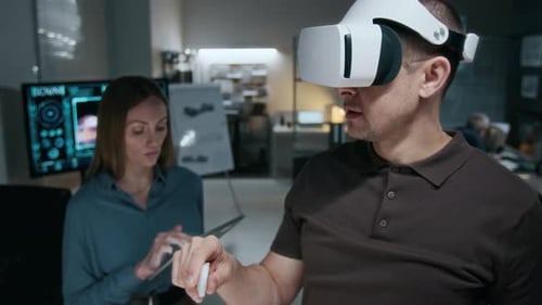 Man Using Virtual Reality Headset in Office