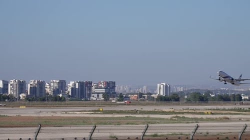 Passenger plane registration taking off from large airport