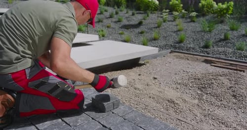 Laying Pavers in a Modern Garden Landscape