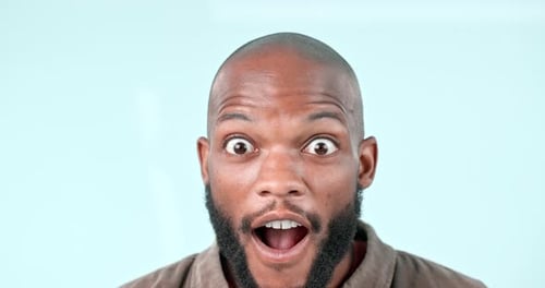 Surprise, wow or face of black man in studio with gossip, story and fake news in studio on blue