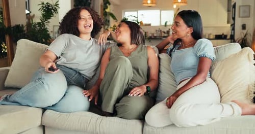 Three Friends Relaxing on the Couch at Home