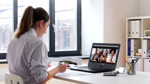 Young businesswoman working remotely from home office having video conference