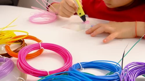 Child Drawing with a 3D Printing Pen