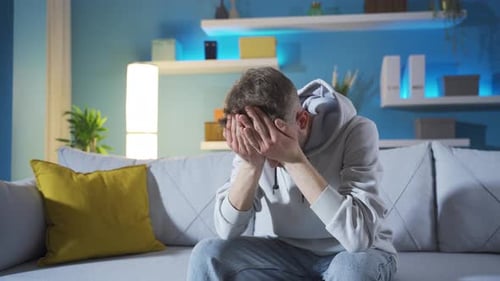 Depressed young man is not happy, disappointed, helpless and sad.