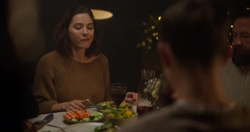Friends Enjoying Dinner Together at Night