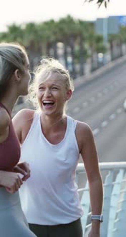 Fitness, break or friends in city with laugh, funny conversation or friendly chat in training pause