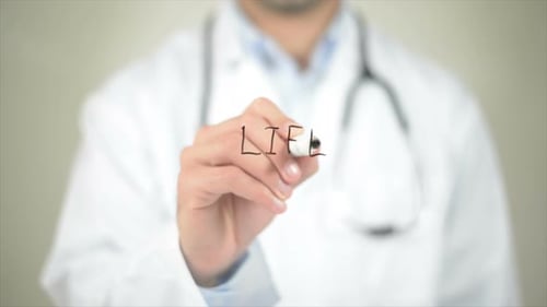 Doctor Writing on Clear Surface