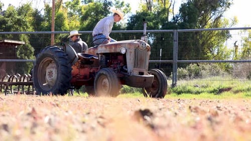 Men Working on Farm with Vintage Tractor