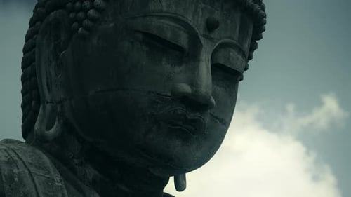 Majestic Big Stone Buddha Statue with Clouds in the Background
