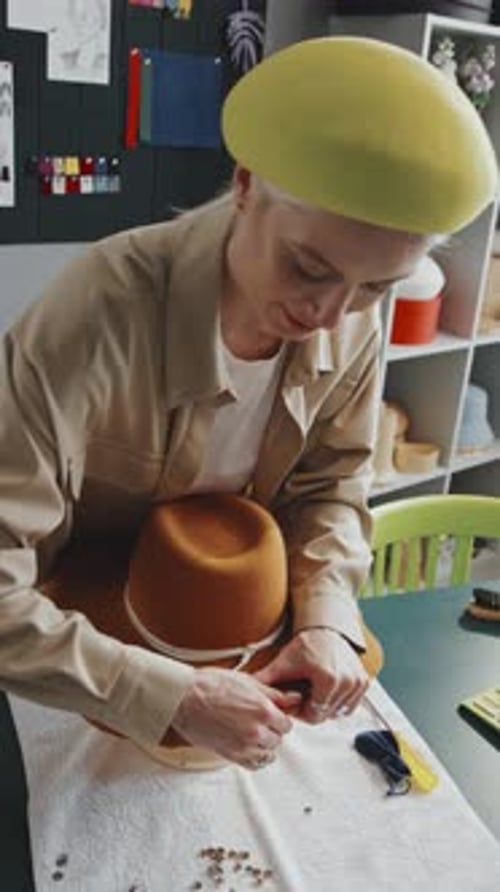 Adult Fashion Designer Working on Hat in Studio