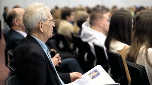 Doctor of economic sciences reads booklet at moscow Russia finance forum