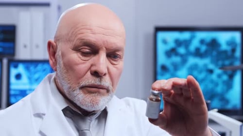 Medical Researcher Inspecting Medicine Vial in Laboratory