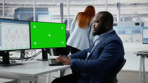 Green Screen PC Analyzing PCB Architecture and Man in Semiconductors Factory