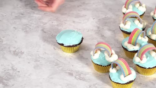 Decorating Chocolate Cupcakes with Buttercream Frosting and Rainbow Candy