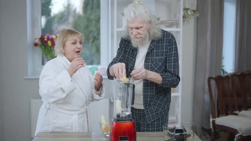 Senior Couple Prepares Healthy Smoothie Together at Home