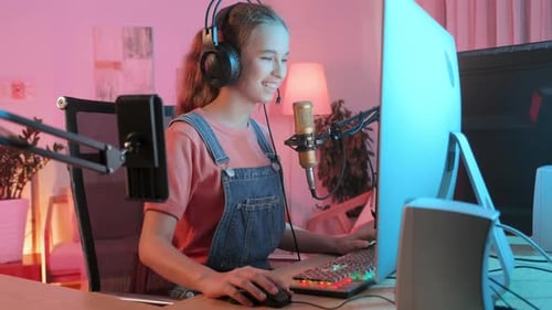Girl Plays Video Game at Home, Smiling, Lifestyle Stock Footage ft. gaming pc & led light - Envato