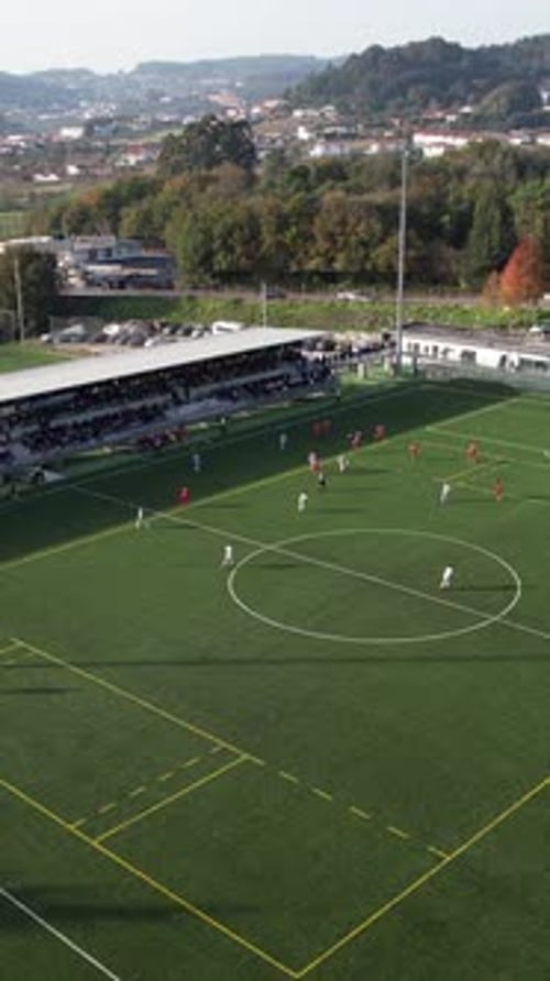 Aerial View of Soccer Game on Green Field