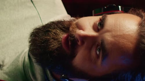 Bearded Man with Gaming Headphones and Microphone