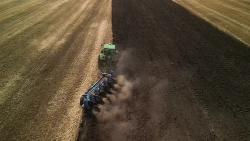 Tractors plowing the field in Ukraine