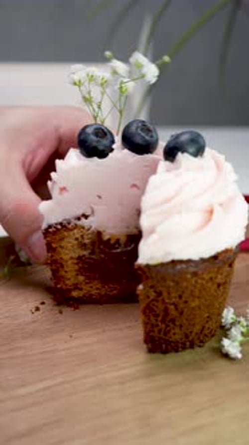 Cupcake Dessert Cut in Half on Wooden Surface