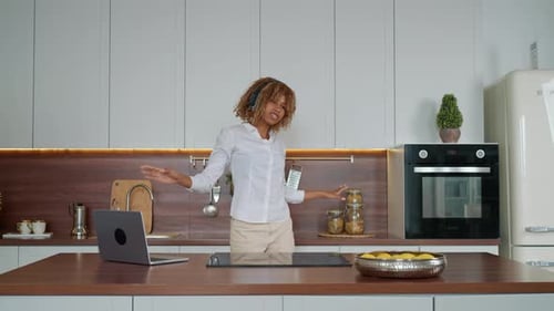 Woman Dancing and Listening to Music at Home