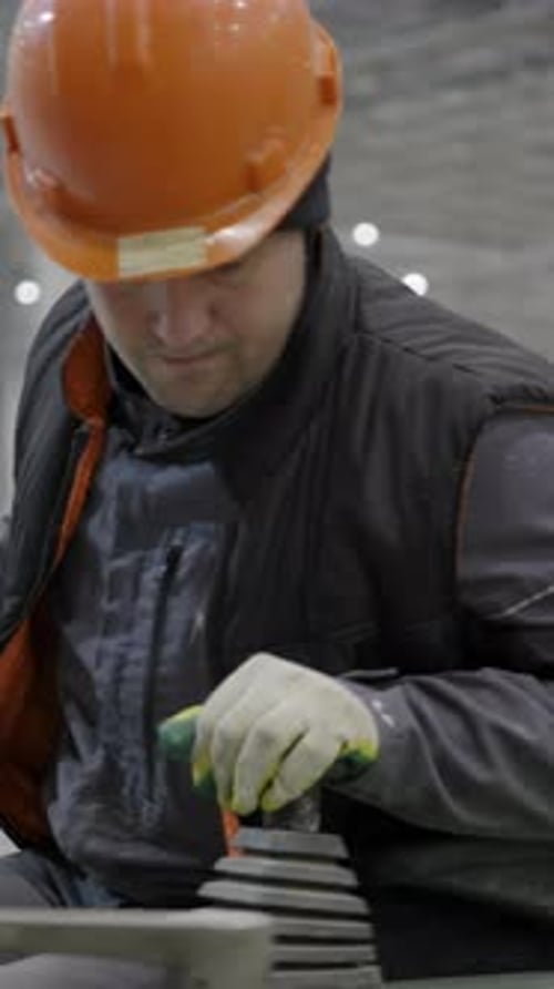 Man operating machinery in warehouse