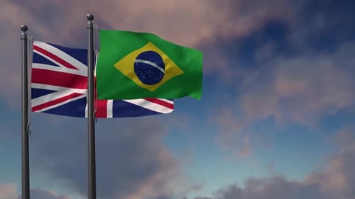 United Kingdom and Brazil Flags Waving Against Cloudy Sky