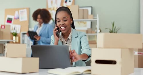 Woman, phone call and boxes with communication for logistics at shipping workshop on laptop