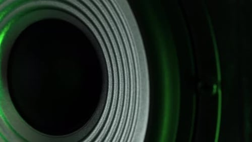 Macro Shoot Of Playing Bass Music Speaker In Green Light