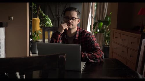 Man Typing on Laptop Working from Home