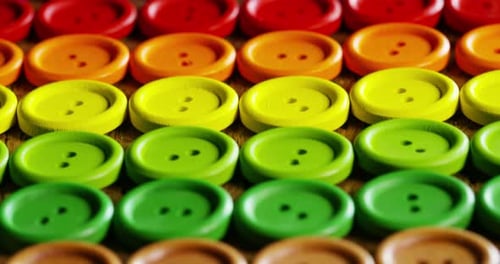roundup of buttons colorful couture, buttons of all high-fashion colors to sew on clothing. concep