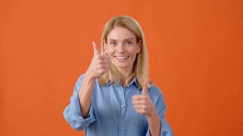 Smiling Woman Gives Two Thumbs Up Approval
