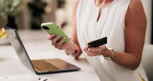 Woman, hands and phone with credit card on laptop for online shopping or remote banking app