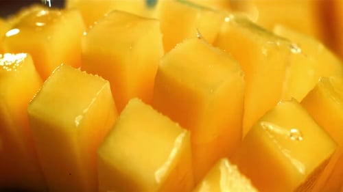 Juicy Mango Chunks with Water Droplets Close-Up