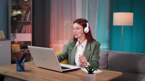 Woman Works at Home Office with Laptop