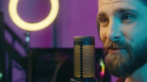 Bearded Adult Recording Audio on Microphone