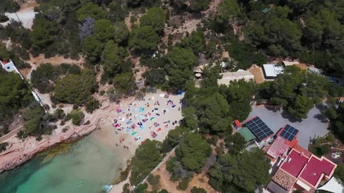 Aerial drone footage of a beach known as Cala Gracioneta in the village of Sant Antoni in Ibiza