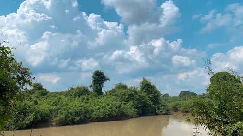 Time Lapse View Of Beautiful Blue Sky With White Clouds And River