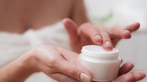 Daily Care, Beautiful Woman With Pleasure Rubs Anti Wrinkle Cream In The Spa Treatment Room General