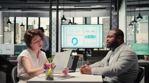 Black Confident Applicant Discusses Resume Presentation with HR Manager