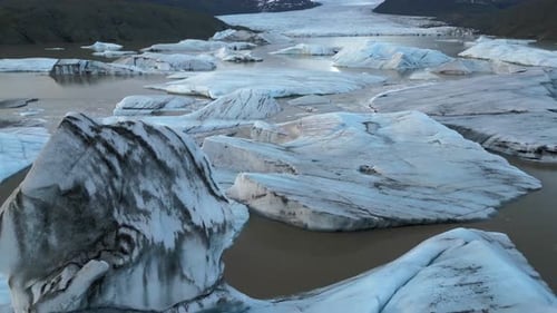 Aerial view of the largest ice cap in Europe, Svinafellsjokull Glacier Lagoon, Melting iceberg, Icel