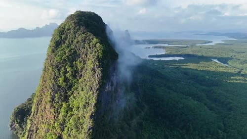 Wispy Clouds Over Towering Limestone Karsts In Phang Nga Bay, Thailand. Aerial Drone Shot