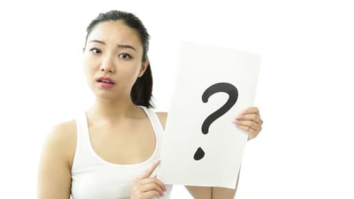 Attractive woman from east asia in her 20s isolated in studio