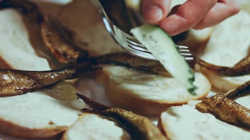 Contour Highlighting Effect of Hands Spread Tomatoes and Cucumbers on Bread Butter