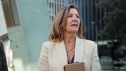 Business Team Having a Discussion Outside Office Building