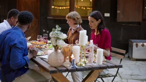 Friends Sharing a Meal in a Cozy Setting