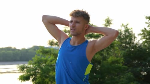 Close Up of Handsome Man Athlete Doing Exercise Outdoor Stretching Muscles