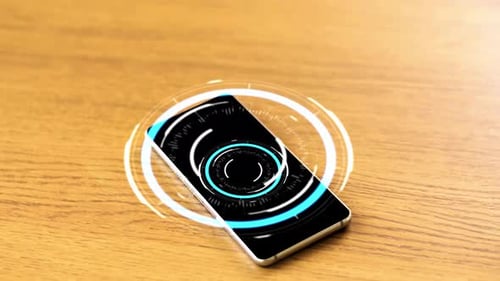 Smartphone Displaying Animated Circular User Interface on Table
