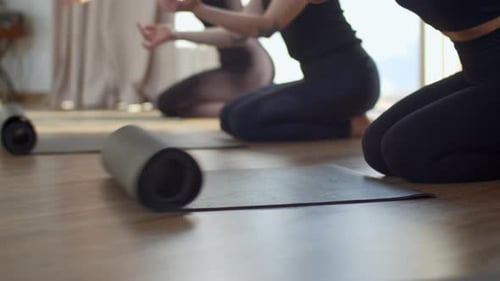 Close Up of Female Sports Group Rolling Mats to Start Pilates Media Beginning of Exercises and